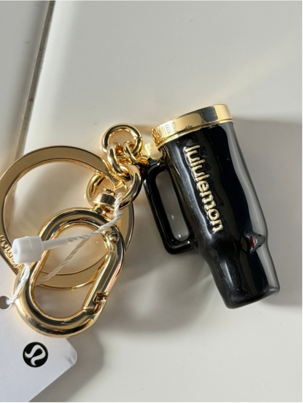 Lululemon Black and Gold key chain